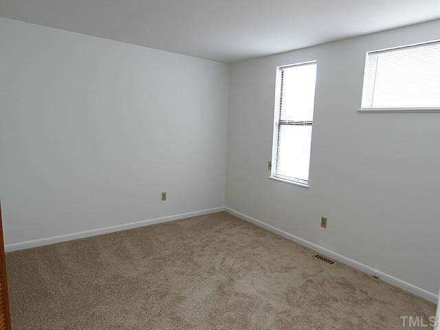 816 Berkeley Street, Unit B Durham, NC 27705 - Photo 7 of 12 an empty room with windows