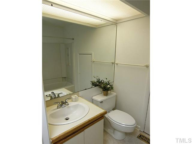 816 Berkeley Street, Unit B Durham, NC 27705 - Photo 10 of 12 a bathroom with a sink toilet and shower