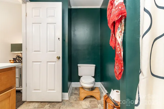 a bathroom with a toilet and a sink