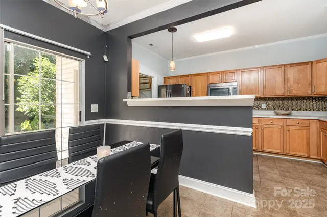 a kitchen with a stove a sink and cabinets
