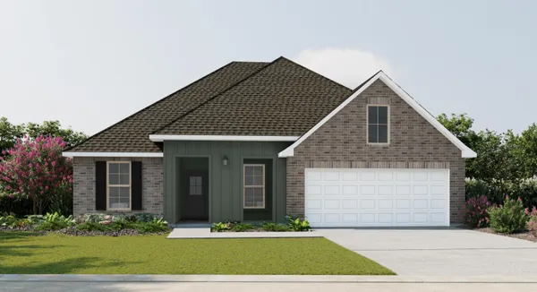 a front view of a house with yard and green space