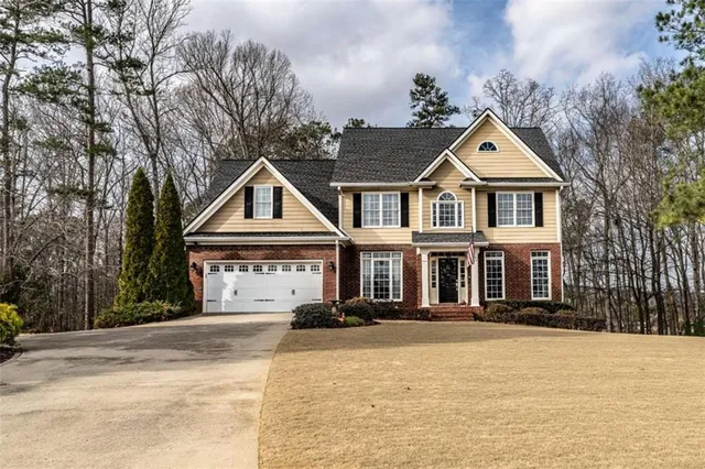 a front view of a house with a yard