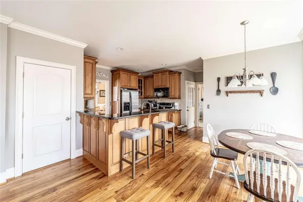 a view of kitchen with furniture and wooden floor