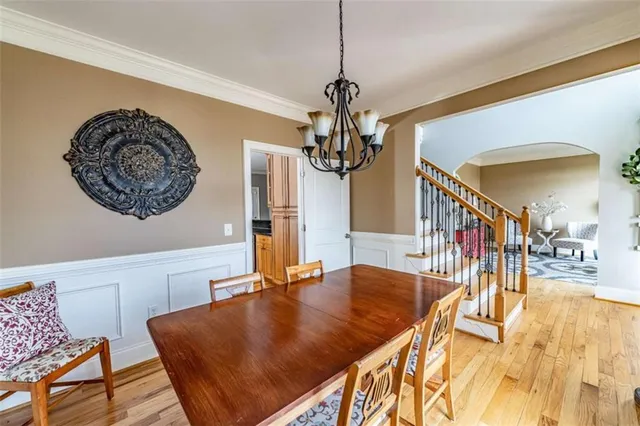 a living room with furniture a rug and a chandelier