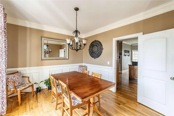 a dining room with wooden floor