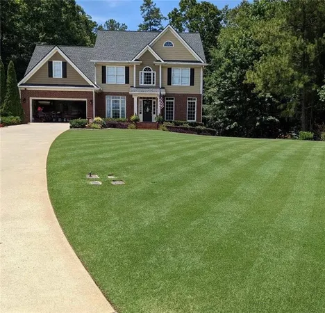 a front view of a house with a yard