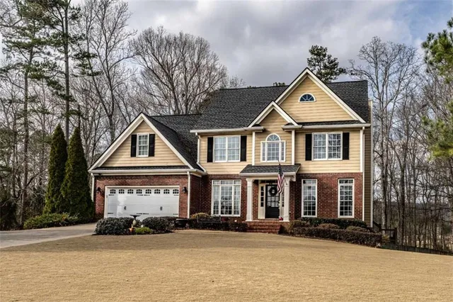 a front view of a house with a yard