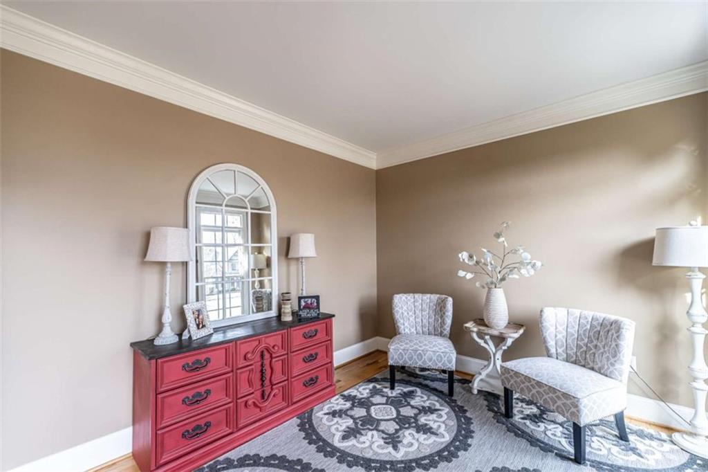 15 Quarter Horse Drive Northwest Rome, GA 30165 - Photo 21 of 57 a living room with furniture a rug and a chandelier