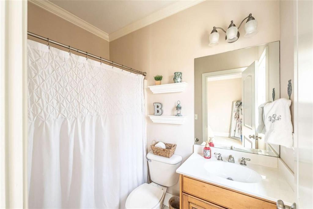 15 Quarter Horse Drive Northwest Rome, GA 30165 - Photo 24 of 57 a bathroom with a sink vanity mirror and toilet
