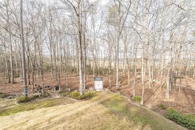 a bedroom with a bed and a ceiling fan with window