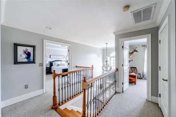 a bedroom with a bed and a ceiling fan with window