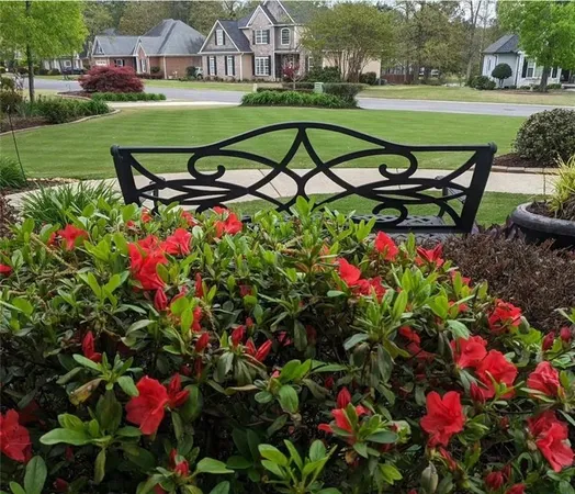 a view of a garden with sitting area