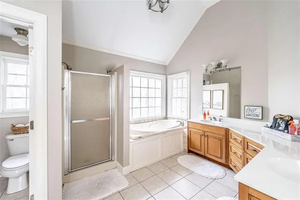 a bath tub sitting next to a white sink