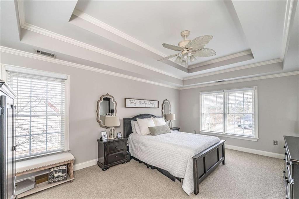 15 Quarter Horse Drive Northwest Rome, GA 30165 - Photo 32 of 57 a bedroom with a bed and a ceiling fan with window