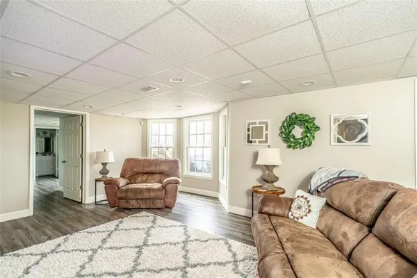 a room with lots of wooden furniture and cabinets