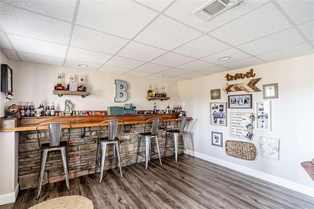 15 Quarter Horse Drive Northwest Rome, GA 30165 - Photo 44 of 57 a room with lots of wooden furniture and cabinets