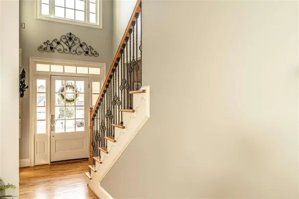 a view of an entryway with wooden floor