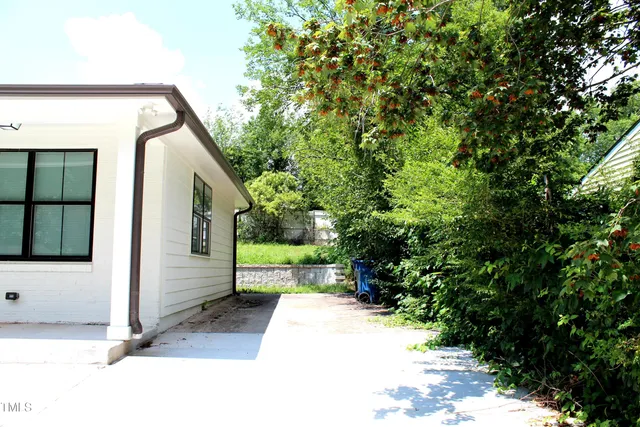 a view of a house with a small yard