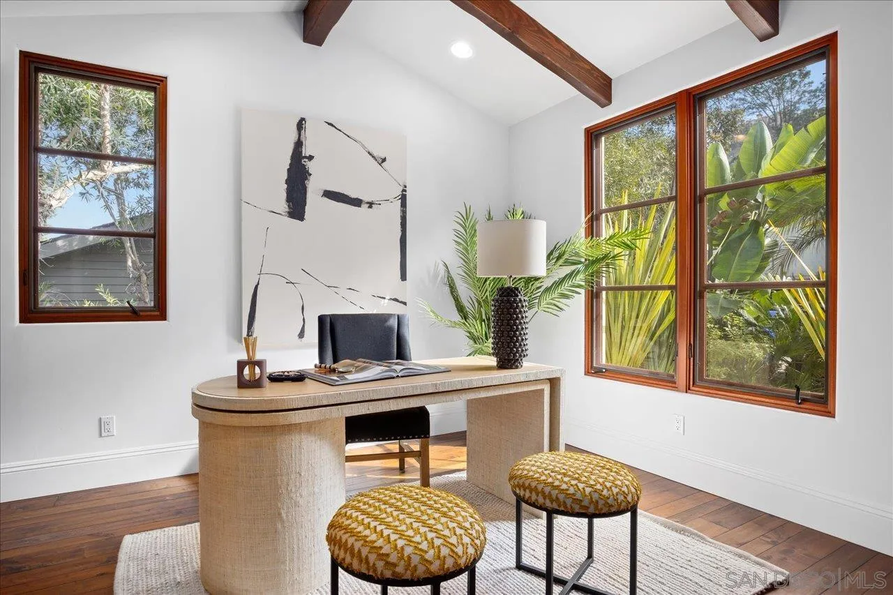 1646 Kearsarge Road La Jolla, CA 92037 - Photo 11 of 35 a living room with furniture a fireplace and a window