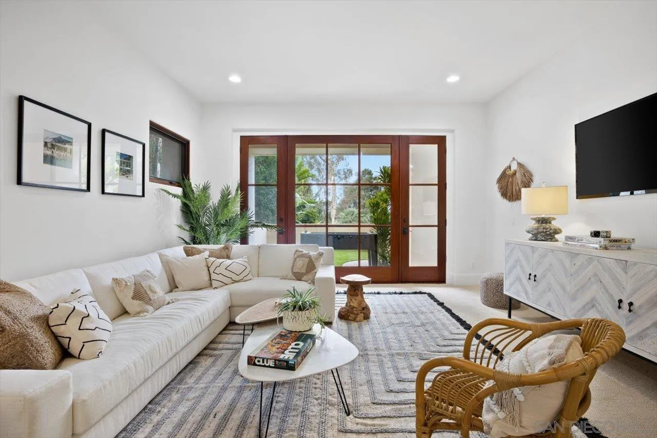 1646 Kearsarge Road La Jolla, CA 92037 - Photo 33 of 35 a living room with furniture and a flat screen tv