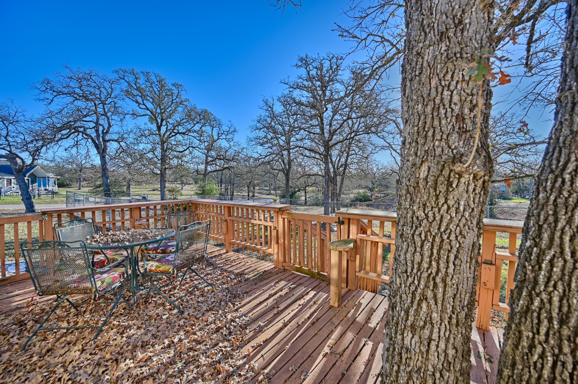 100 Choctaw Crest Somerville, TX 77879 - Photo 10 of 26 a view of a balcony with wooden floor and fence