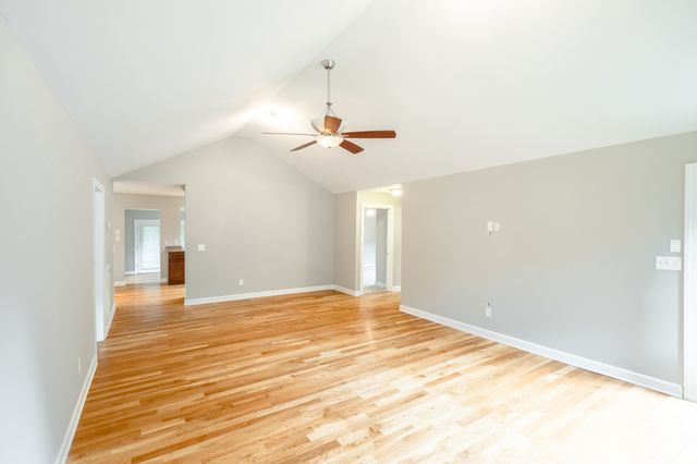 a view of a room with a ceiling fan
