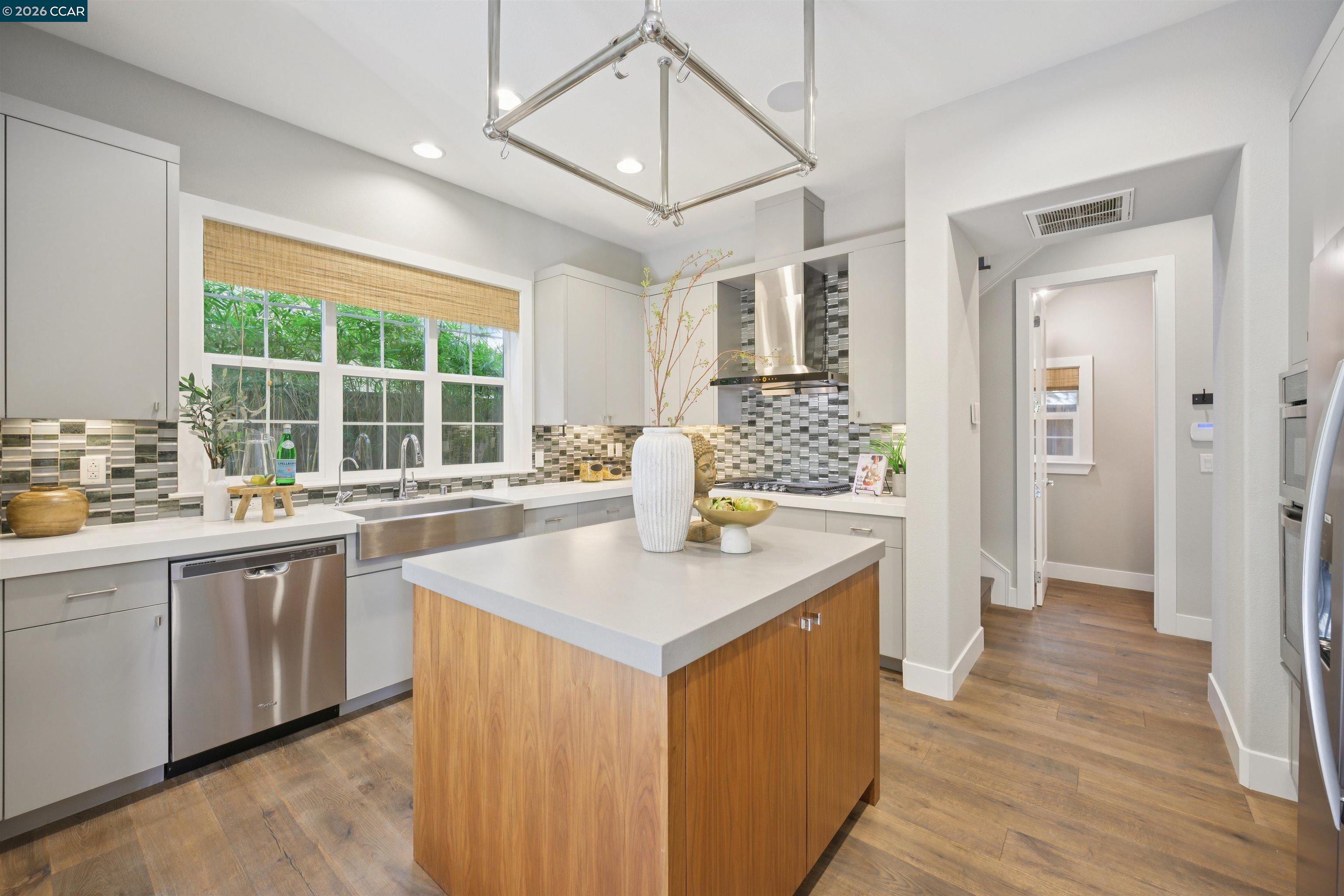 5162 Rowan Drive San Ramon, CA 94582 - Photo 13 of 57 a kitchen with stainless steel appliances granite countertop a sink and wooden floor