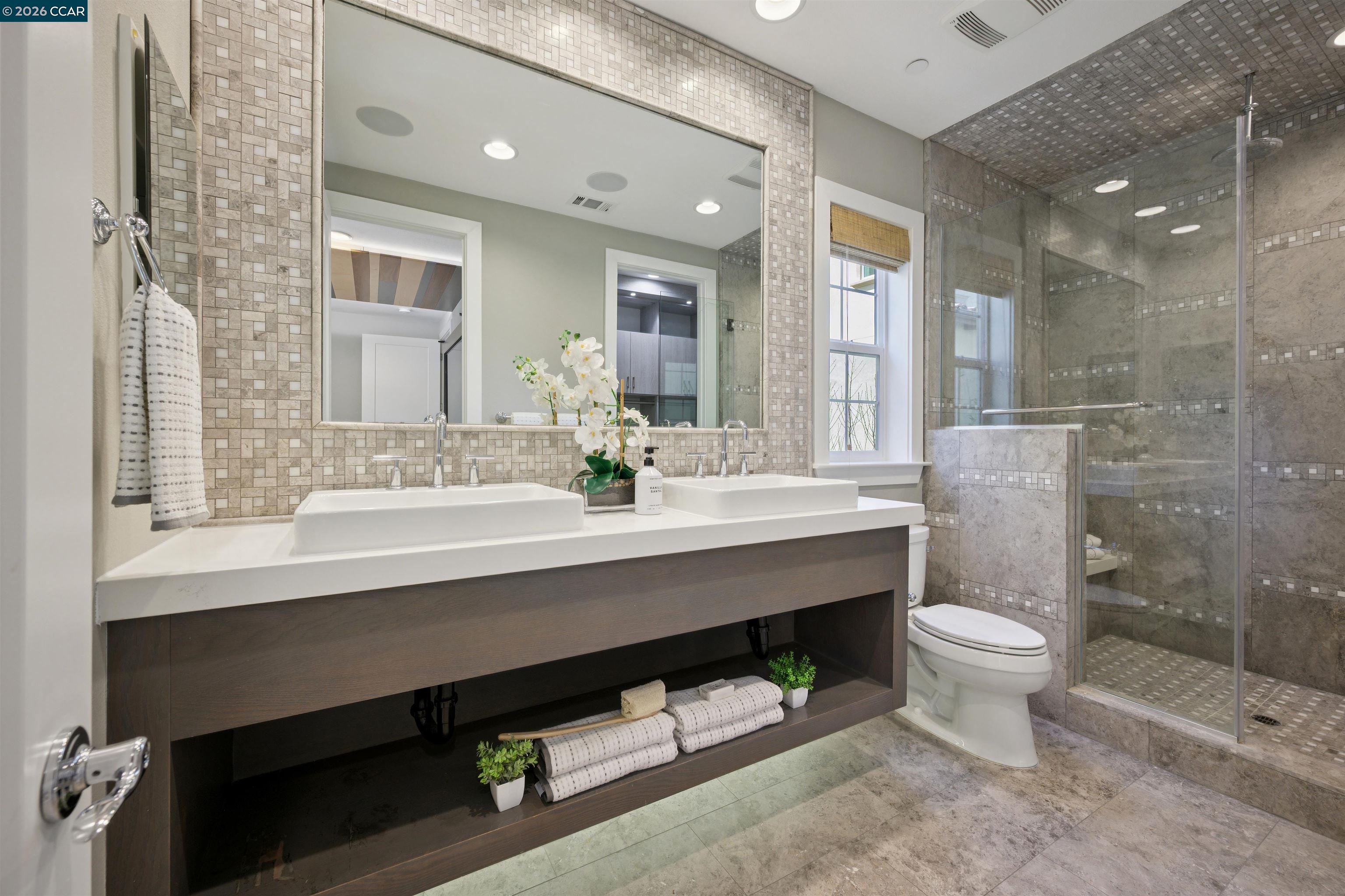 5162 Rowan Drive San Ramon, CA 94582 - Photo 27 of 57 a bathroom with a sink a toilet and shower