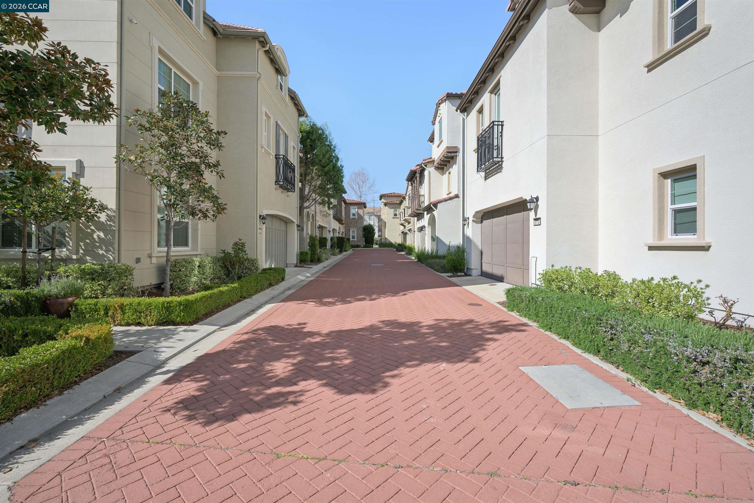 5162 Rowan Drive San Ramon, CA 94582 - Photo 5 of 57 a view of a brick house with a yard