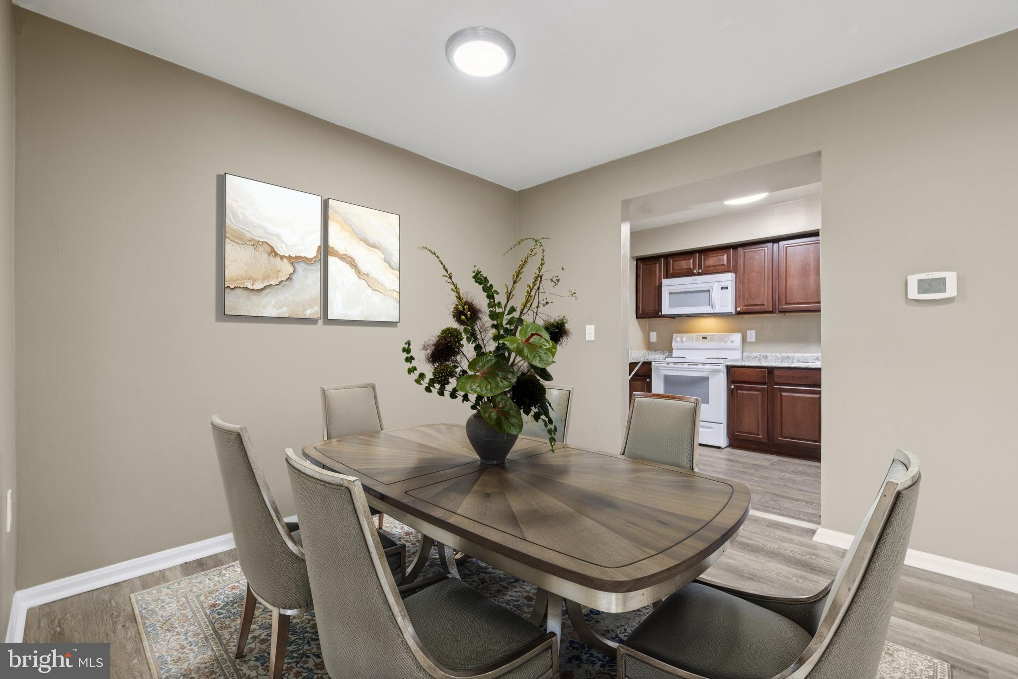 9075 North Laurel Road, Unit E Laurel, MD 20723 - Photo 6 of 20 a dining room with furniture and window