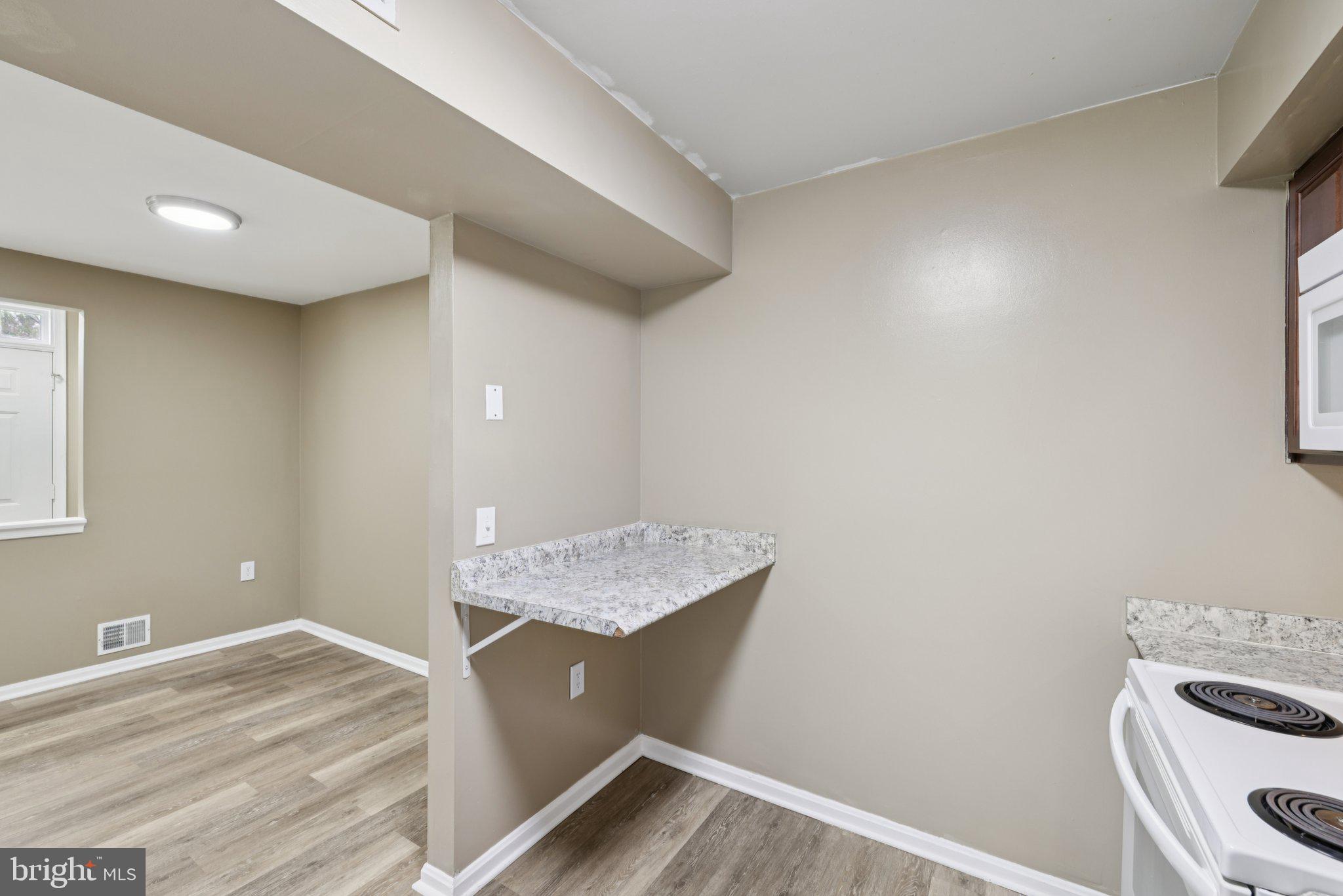 9075 North Laurel Road, Unit E Laurel, MD 20723 - Photo 10 of 20 a view of workspace with washer and dryer