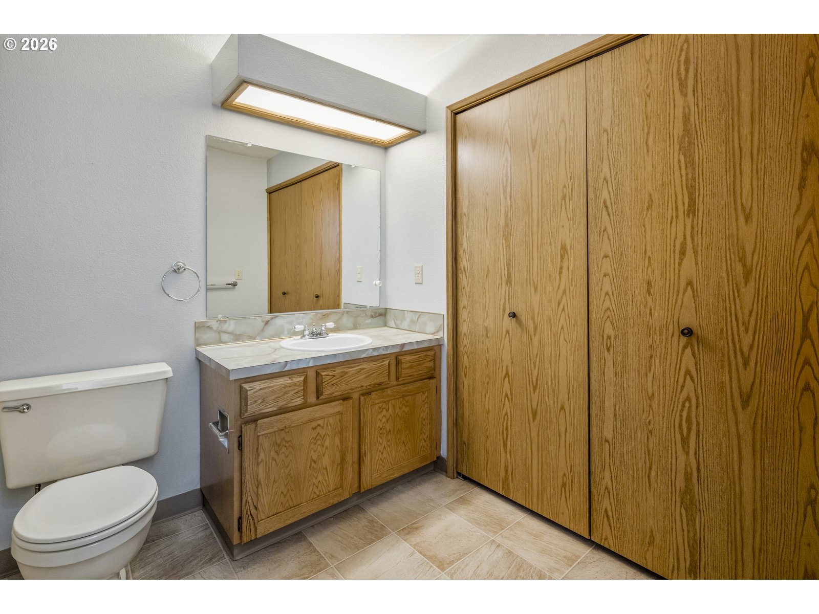 12516 Southeast Stark Street, Unit C Portland, OR 97233 - Photo 21 of 47 a bathroom with a granite countertop sink toilet and shower