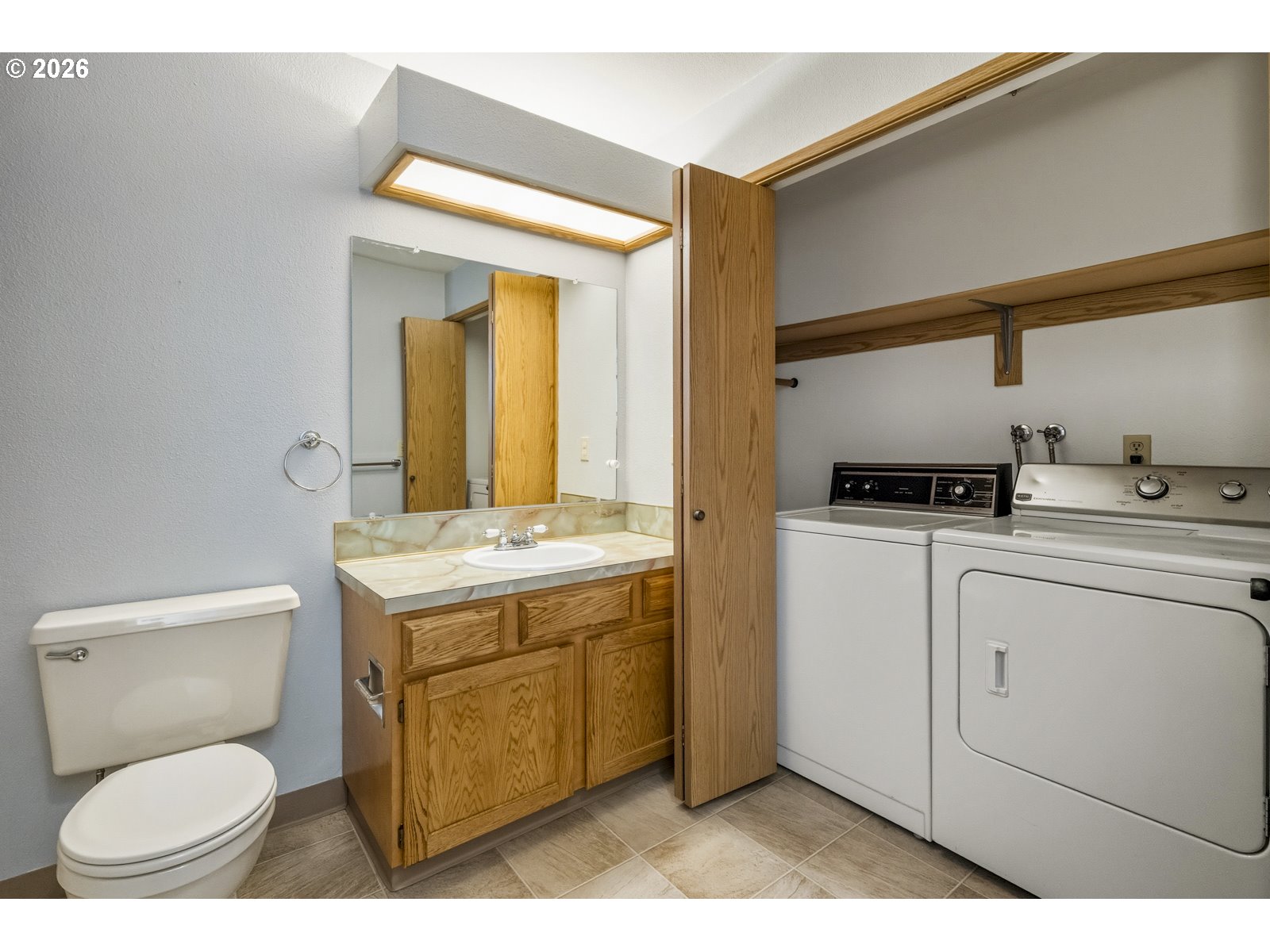 12516 Southeast Stark Street, Unit C Portland, OR 97233 - Photo 22 of 47 a bathroom with a granite countertop toilet sink and mirror