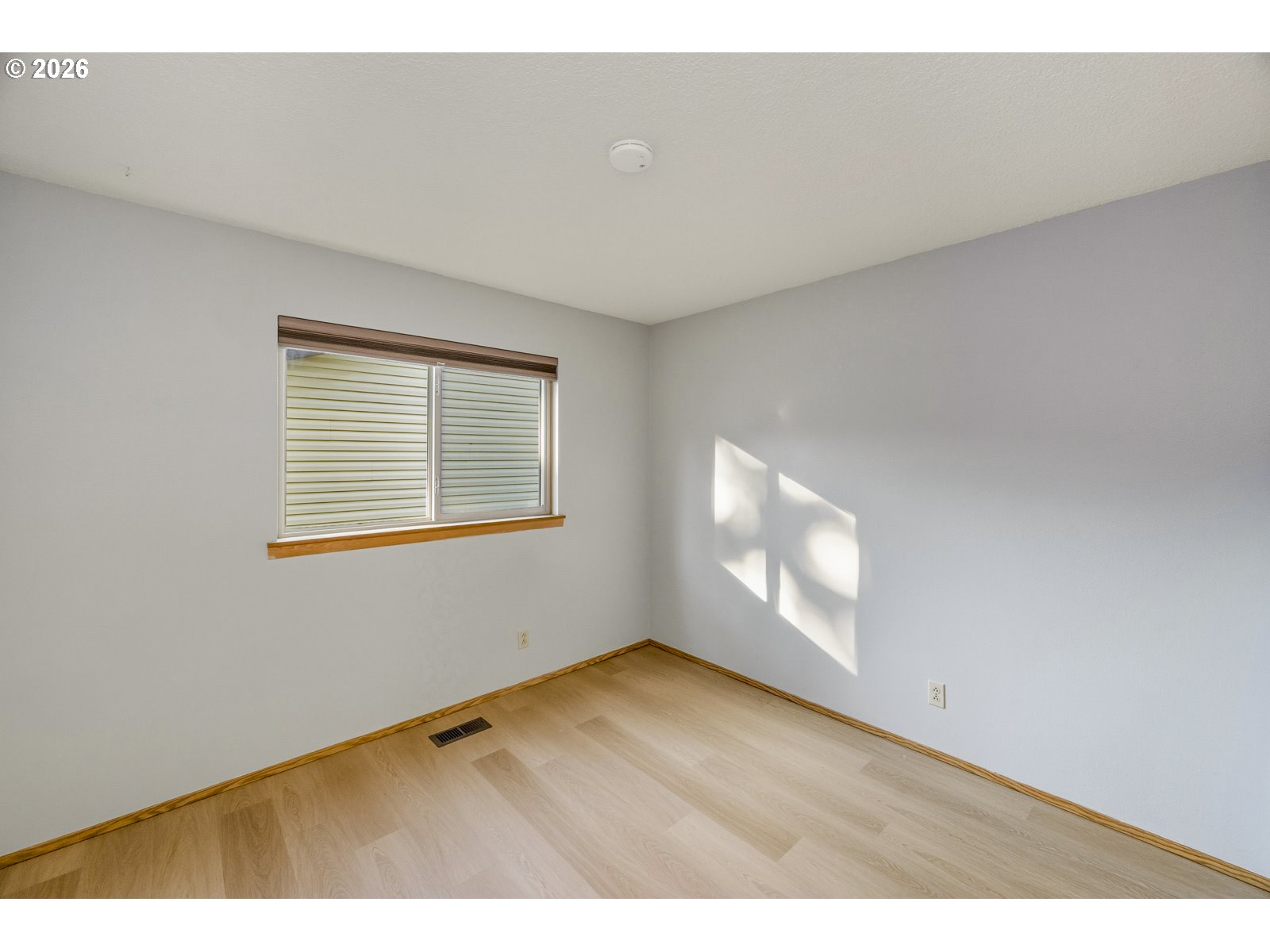 12516 Southeast Stark Street, Unit C Portland, OR 97233 - Photo 24 of 47 a view of an empty room with a window