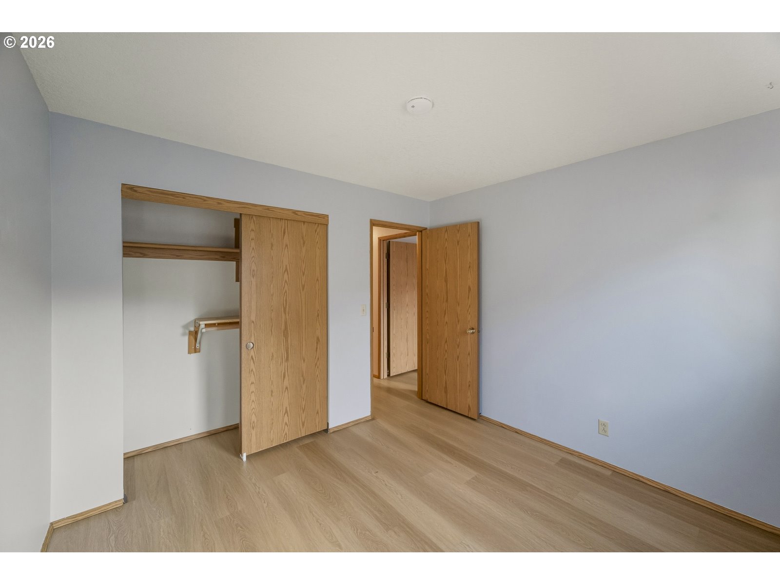 12516 Southeast Stark Street, Unit C Portland, OR 97233 - Photo 27 of 47 a view of an empty room with wooden floor