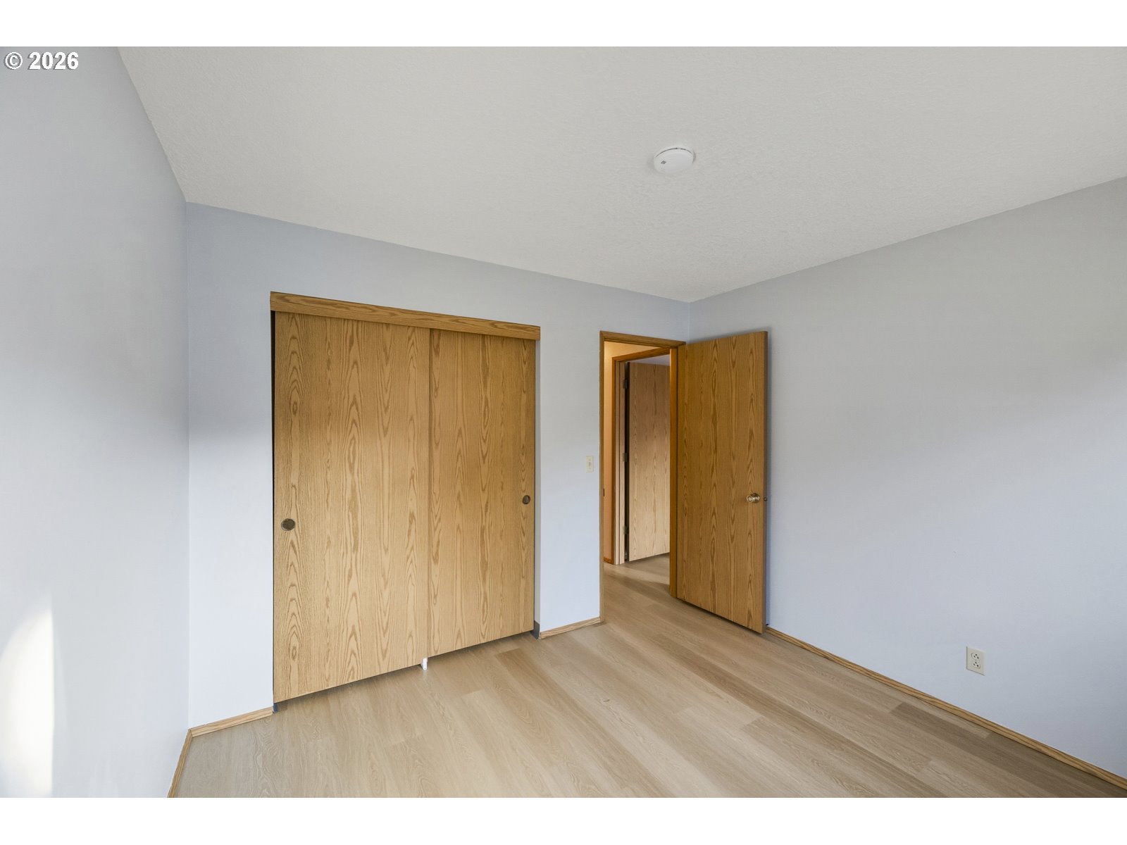 12516 Southeast Stark Street, Unit C Portland, OR 97233 - Photo 28 of 47 a view of an empty room with wooden floor