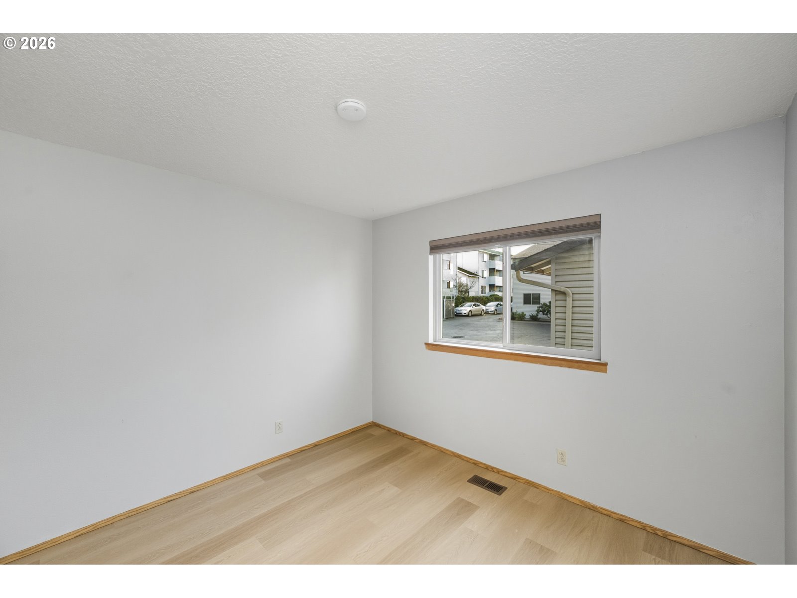 12516 Southeast Stark Street, Unit C Portland, OR 97233 - Photo 29 of 47 a view of an empty room with a window