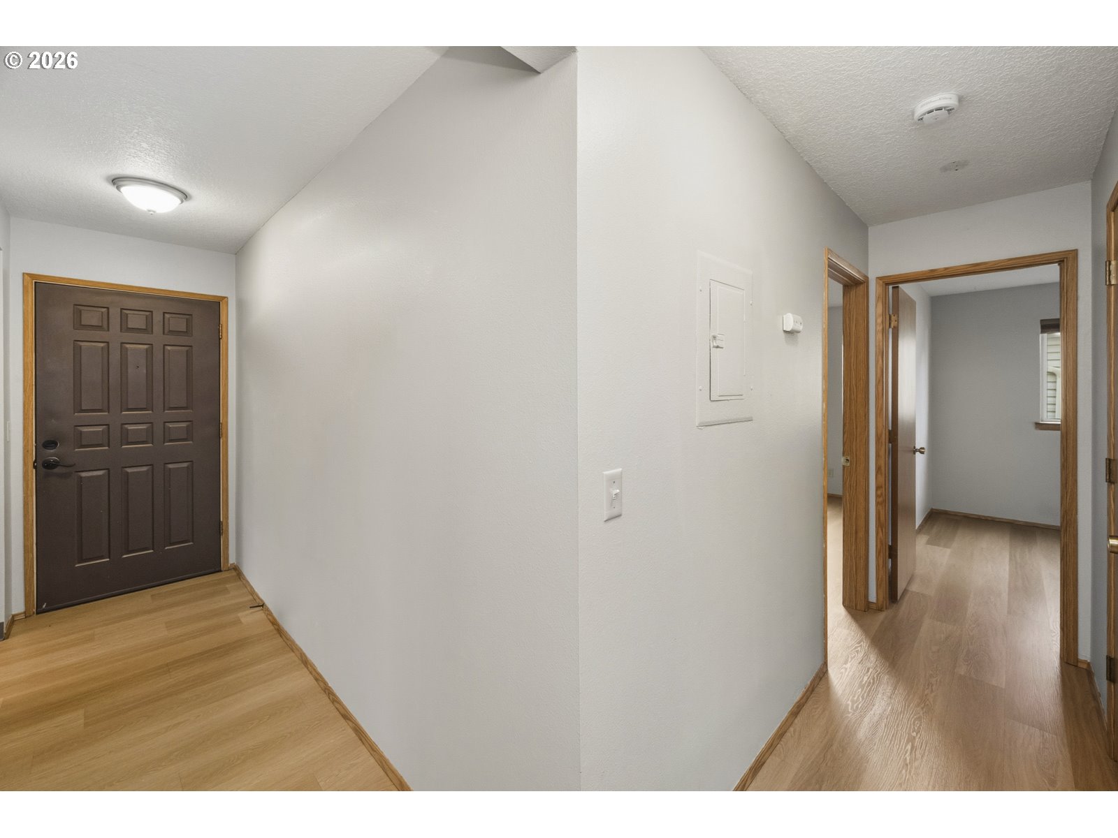 12516 Southeast Stark Street, Unit C Portland, OR 97233 - Photo 3 of 47 a view of a hallway with wooden floor