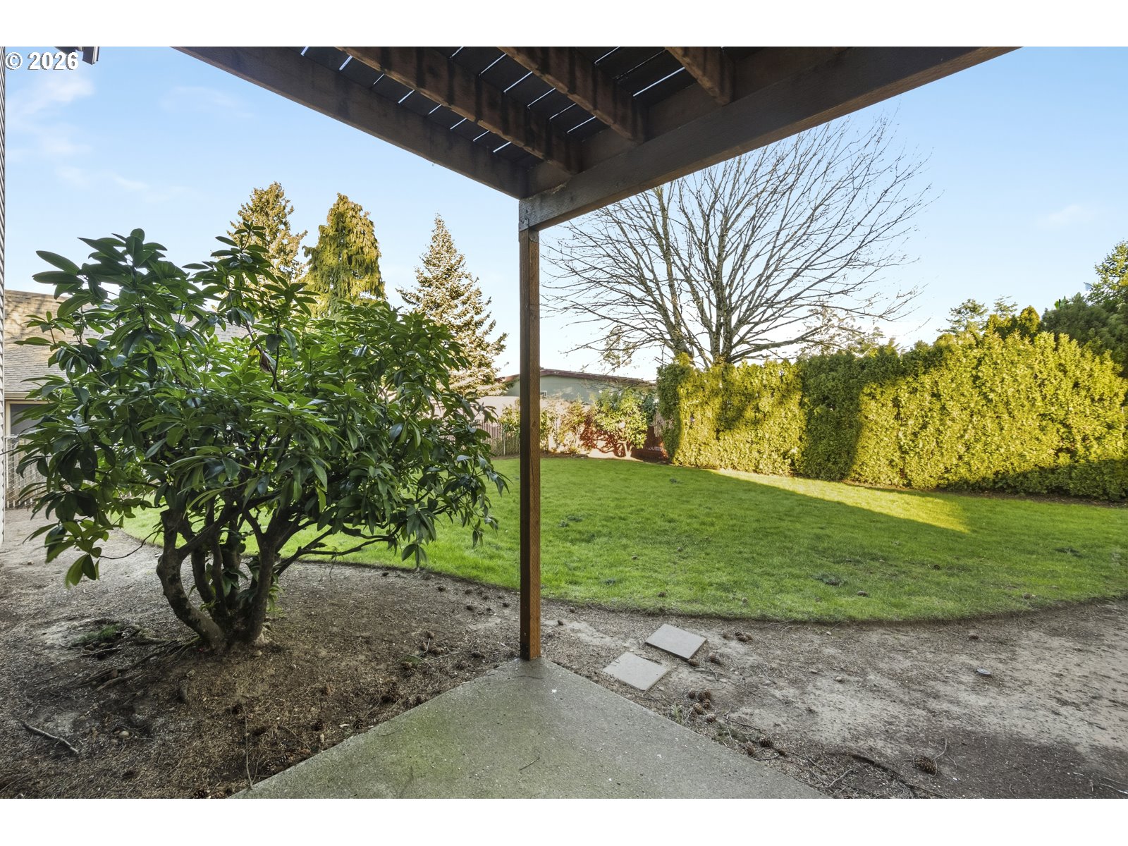 12516 Southeast Stark Street, Unit C Portland, OR 97233 - Photo 39 of 47 a view of a yard with an tree