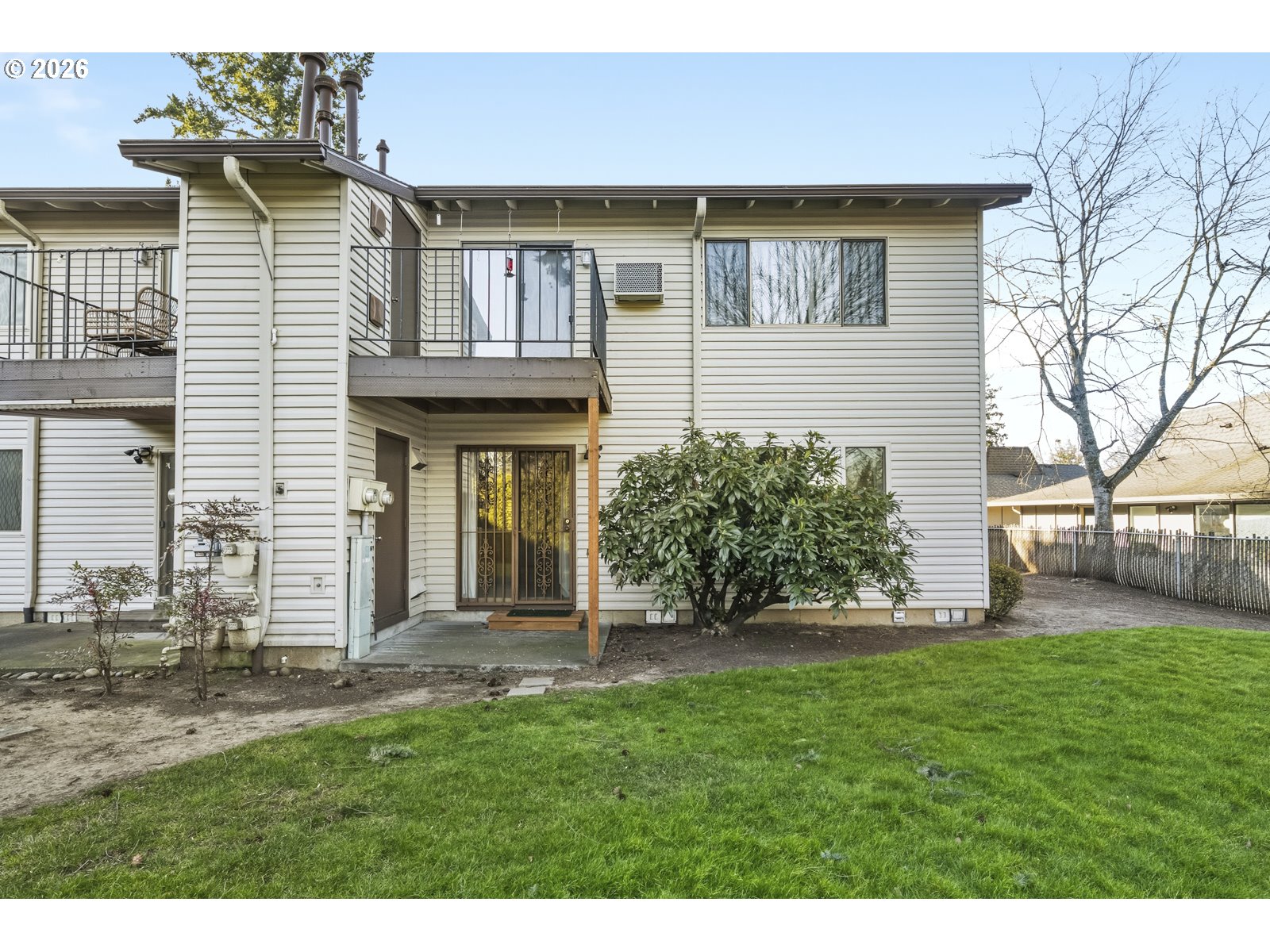 12516 Southeast Stark Street, Unit C Portland, OR 97233 - Photo 42 of 47 a front view of a house with a yard