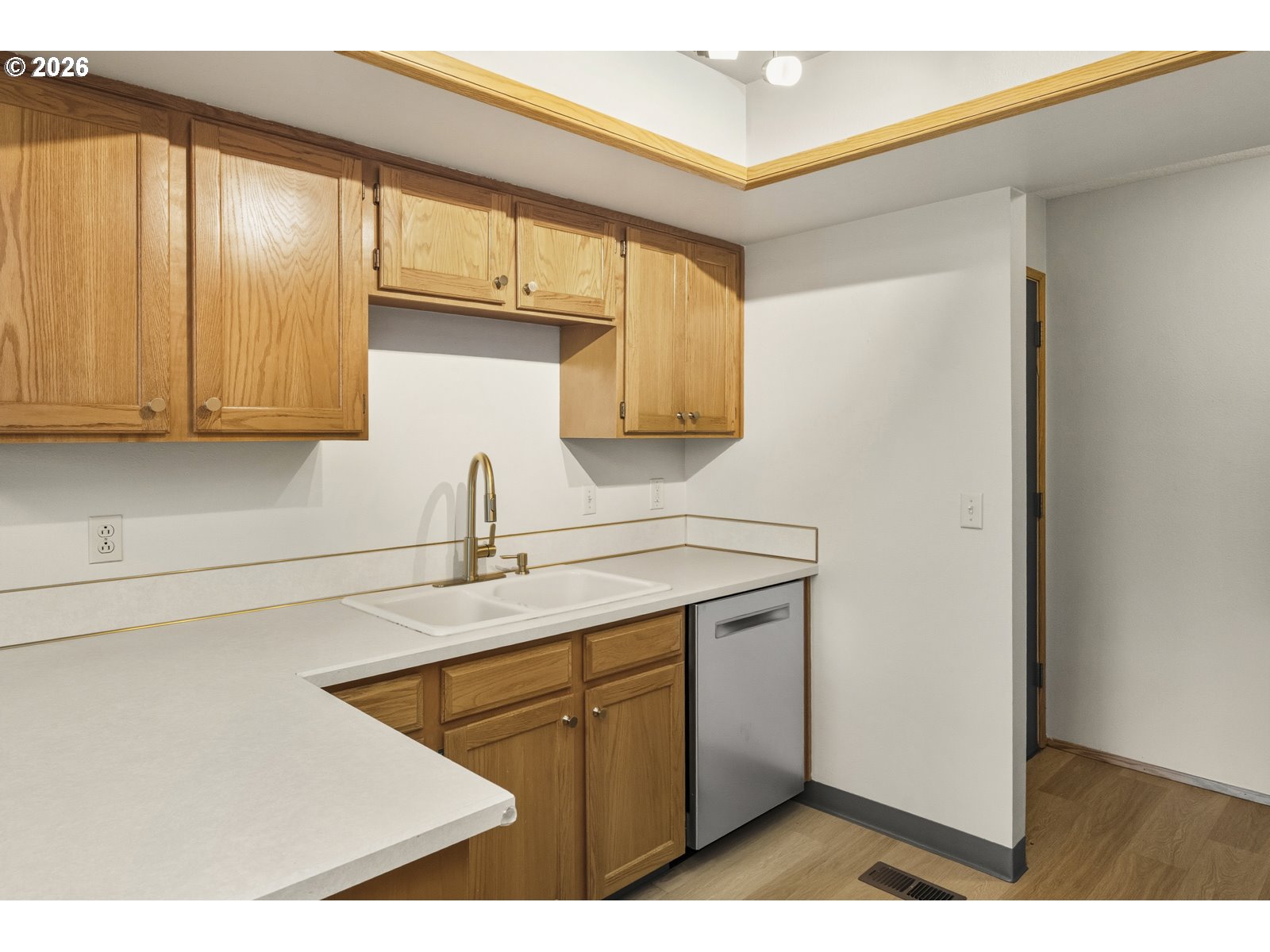12516 Southeast Stark Street, Unit C Portland, OR 97233 - Photo 6 of 47 a kitchen with a sink cabinets and a window