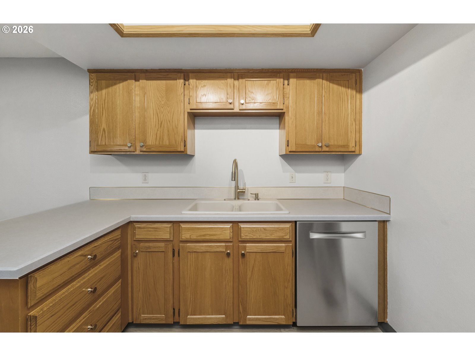 12516 Southeast Stark Street, Unit C Portland, OR 97233 - Photo 7 of 47 a kitchen with a sink and cabinets