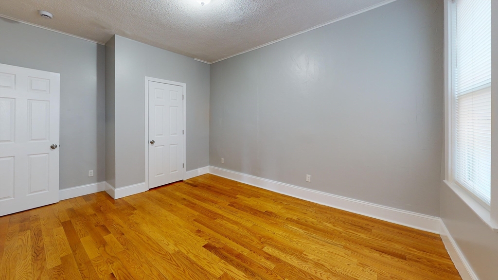 8 Wardman Road, Unit 1 Boston, MA 02119 - Photo 8 of 14 a view of empty room