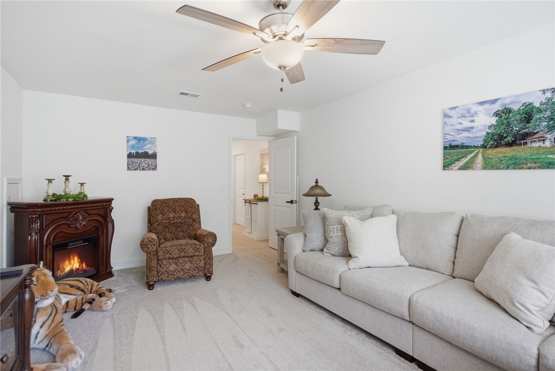 525 16th Circle Walhalla, SC 29691 - Photo 20 of 50 This inviting living room offers comfort and warmth, ideal for quiet relaxation or lively gatherings.