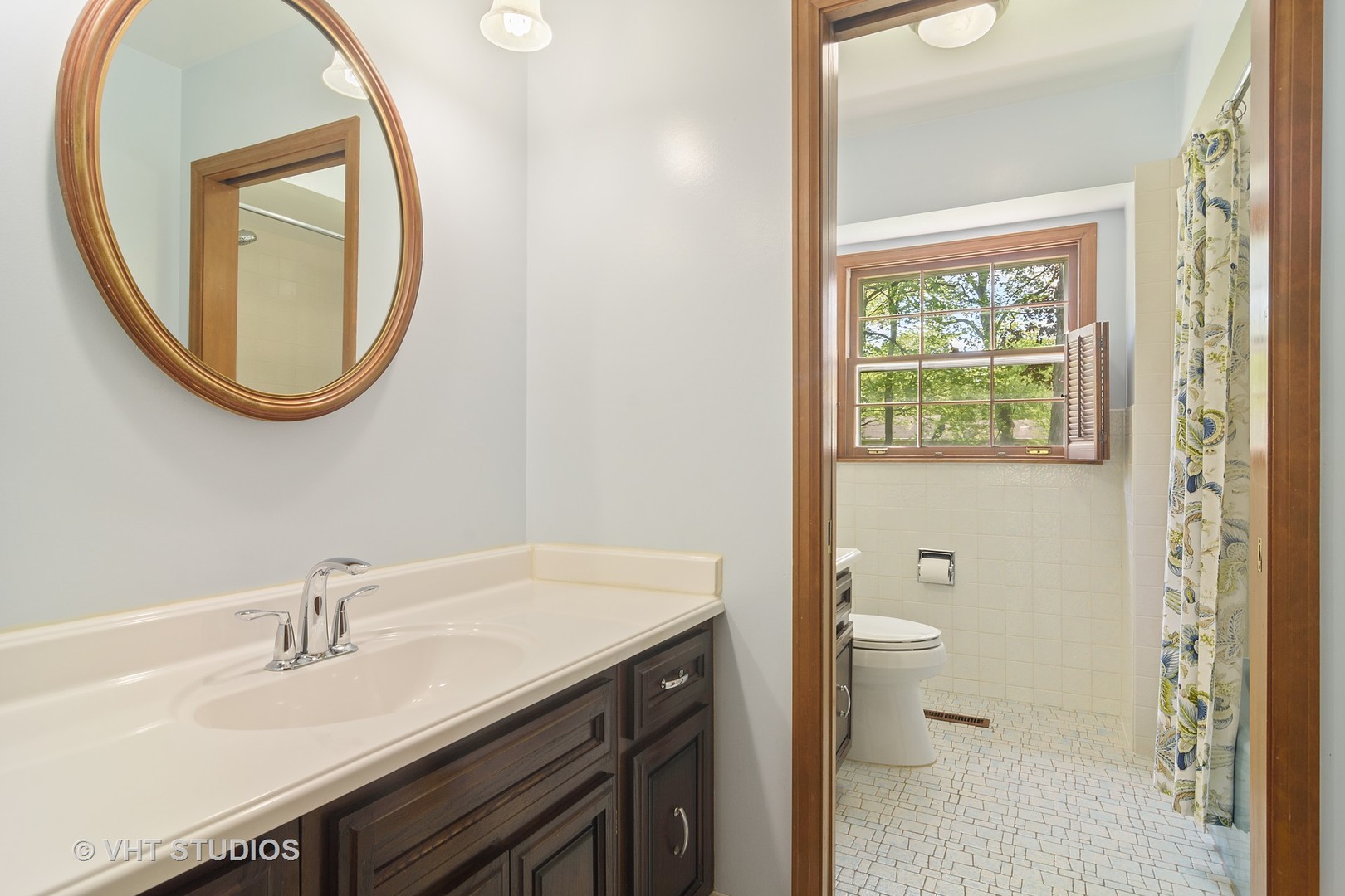 227 Tall Trees Lane Rolling Meadows, IL 60008 - Photo 11 of 15 a bathroom with a sink a toilet and a mirror