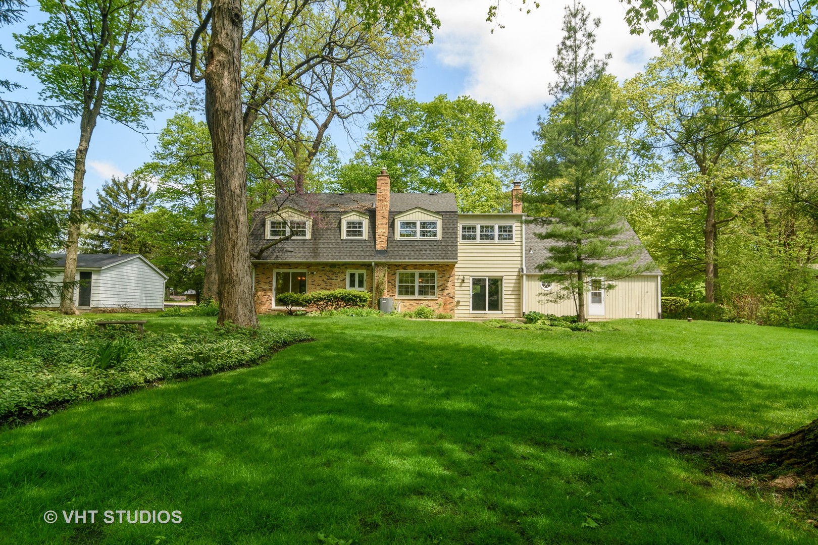 227 Tall Trees Lane Rolling Meadows, IL 60008 - Photo 15 of 15 a front view of a house with a garden