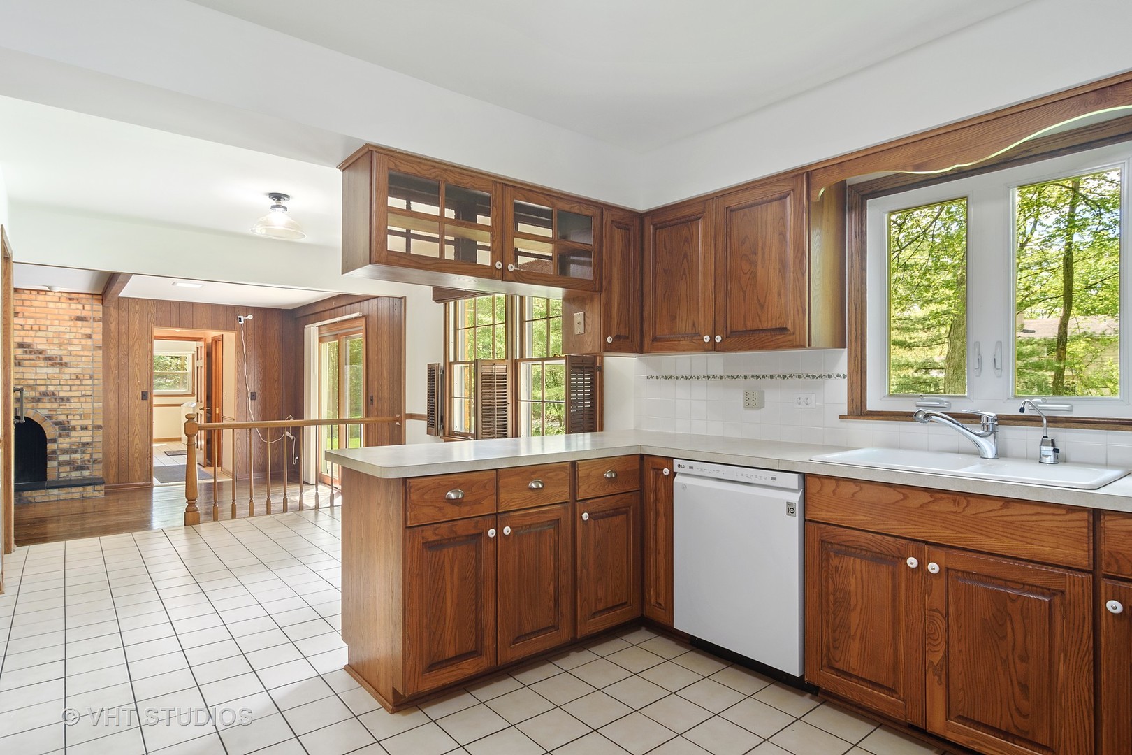 227 Tall Trees Lane Rolling Meadows, IL 60008 - Photo 4 of 15 a kitchen with a sink window and cabinets