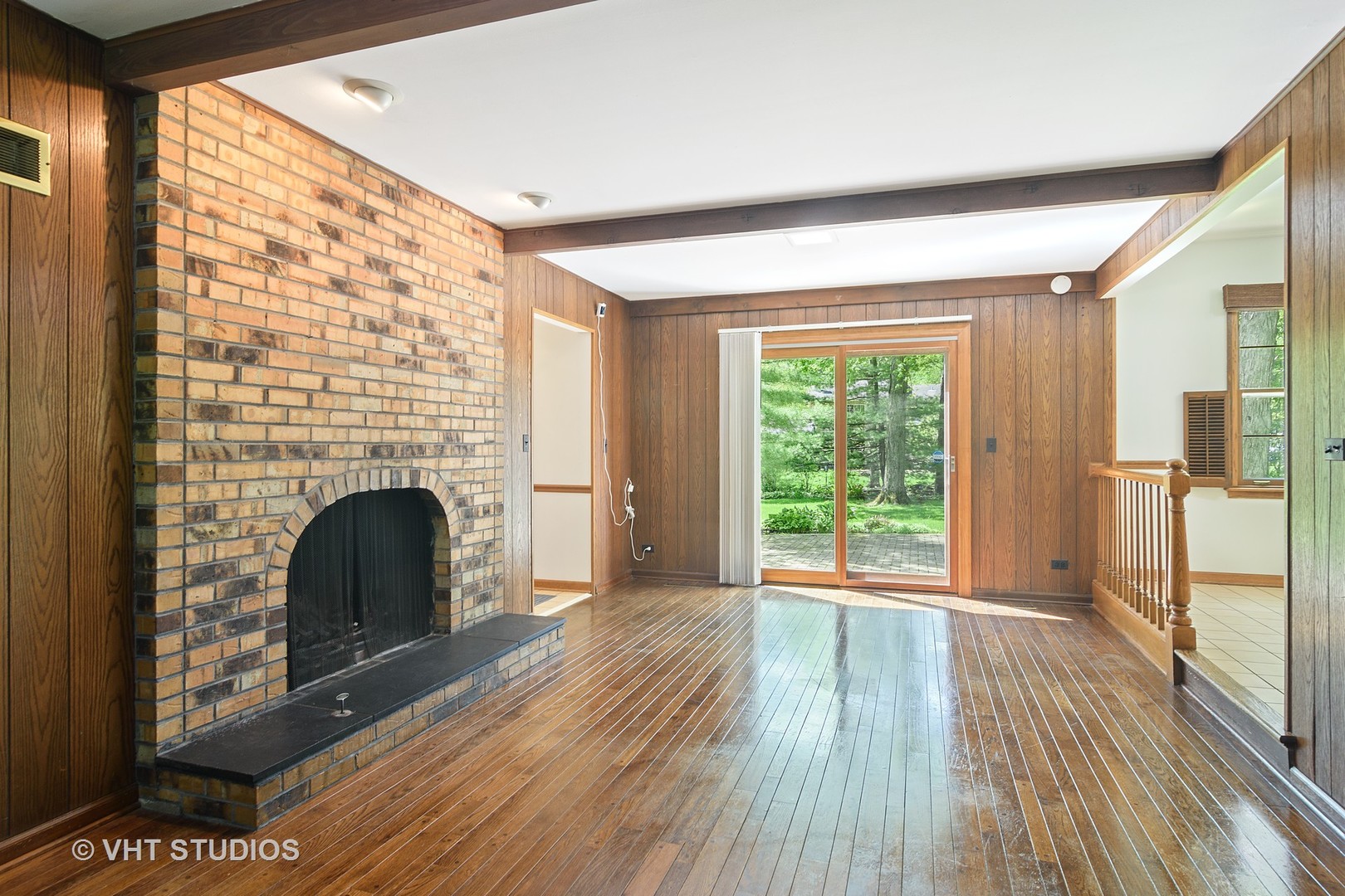 227 Tall Trees Lane Rolling Meadows, IL 60008 - Photo 5 of 15 a view of an empty room with wooden floor and a window