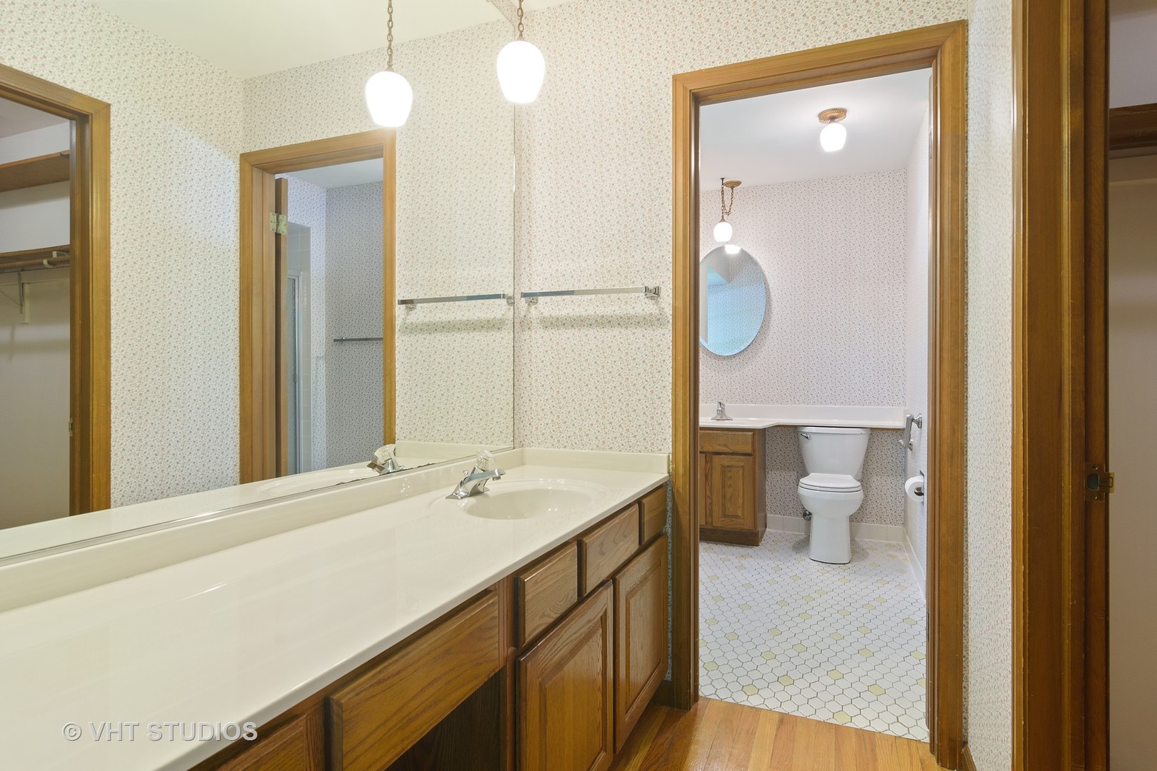 227 Tall Trees Lane Rolling Meadows, IL 60008 - Photo 7 of 15 a bathroom with a sink a toilet and a mirror