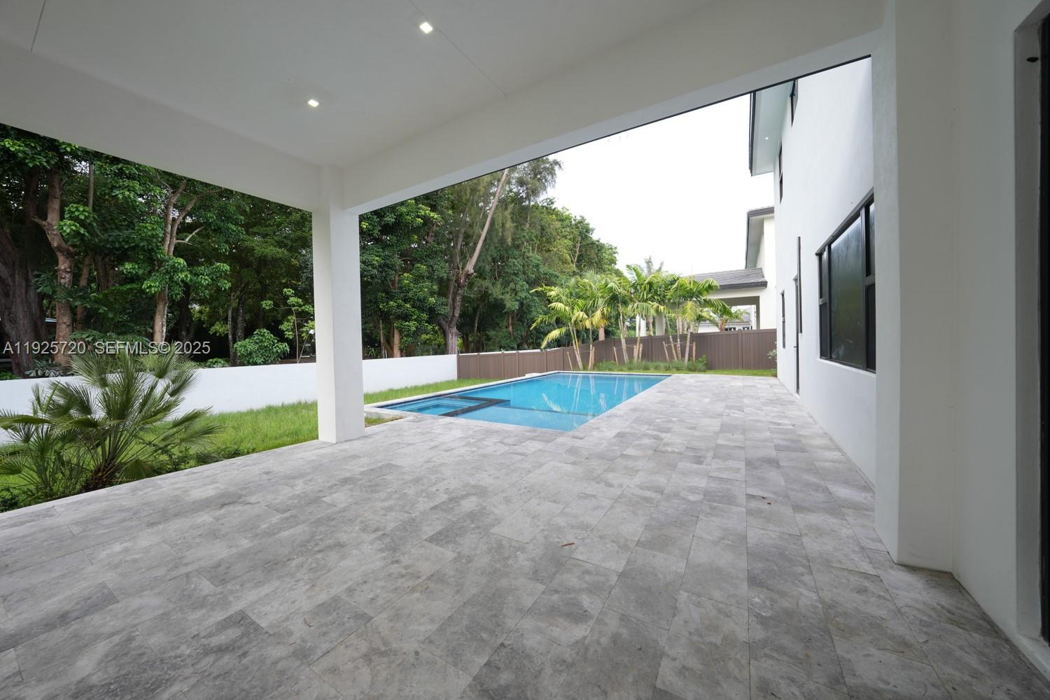 13083 Davie Oaks Drive Davie, FL 33325 - Photo 4 of 10 a view of a house with backyard and porch